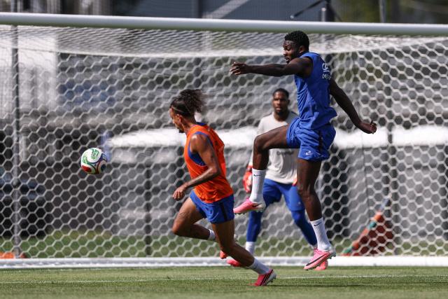 France's forward #09 Marcus Thuram (R) and France's defender #02 Malo Gusto (L) take part in a  training session at Bentley University, the team's base camp, during the 2026 World Cup football tournament in Waltham, near Boston, on June 12, 2026. (Photo by FRANCK FIFE / AFP)