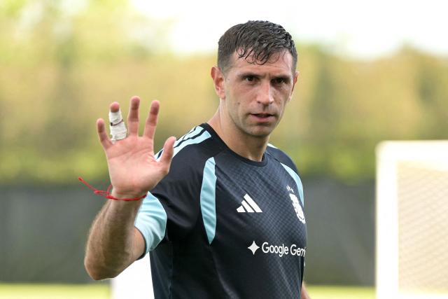 Argentina's goalkeeper Emiliano Martinez waves during a training session for the 2026 FIFA World Cup football tournament at Sporting KC Training Centre in Kansas City on June 12, 2026. (Photo by JUAN MABROMATA / AFP)