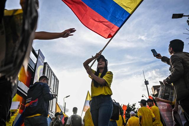Supporters of Colombia's presidential candidate Abelardo de la Espriella, of the Salvadores de la Patria movement, attend a rally in Bogota on June 12, 2026. The Colombian Supreme Court of Justice on June 12, 2026, suspended a lower court ruling that had banned far-right presidential candidate Abelardo de la Espriella from using national symbols and his signature slogan, "Firm for the homeland". The 47-year-old lawyer often uses the military salute of the armed forces and national insignia at political rallies, which are filled with Colombian flags and national football team shirts. Colombia will hold a presidential runoff election on June 21. (Photo by Juan BARRETO / AFP)
