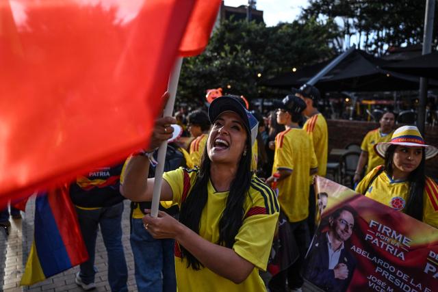 Supporters of Colombia's presidential candidate Abelardo de la Espriella, of the Salvadores de la Patria movement, attend a rally in Bogota on June 12, 2026. The Colombian Supreme Court of Justice on June 12, 2026, suspended a lower court ruling that had banned far-right presidential candidate Abelardo de la Espriella from using national symbols and his signature slogan, "Firm for the homeland". The 47-year-old lawyer often uses the military salute of the armed forces and national insignia at political rallies, which are filled with Colombian flags and national football team shirts. Colombia will hold a presidential runoff election on June 21. (Photo by Juan BARRETO / AFP)