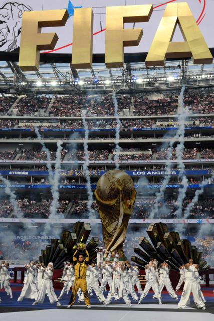 Nigerian rapper Rema, Thai rapper Lisa, and Brazilian singer-songwriter Anitta perform during the opening ceremony of the 2026 World Cup football tournament ahead of the Group D football match between USA and Paraguay at the Los Angeles Stadium in Inglewood on June 12, 2026. (Photo by Patrick T. Fallon / AFP)