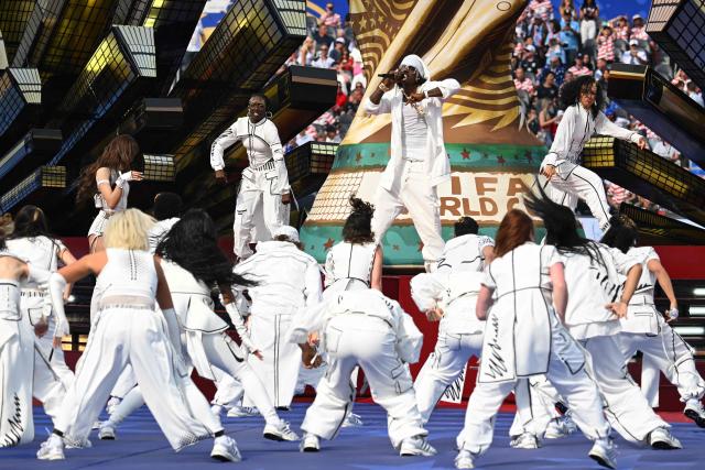 Nigerian rapper Rema (C) performs during the opening ceremony of the 2026 World Cup football tournament ahead of the Group D football match between USA and Paraguay at the Los Angeles Stadium in Inglewood on June 12, 2026. (Photo by Patrick T. Fallon / AFP)