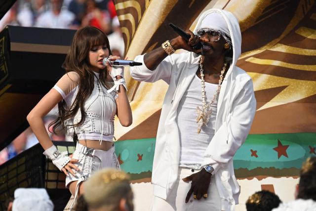 Thai rapper Lisa (L) and Nigerian rapper Rema (R) perform during the opening ceremony of the 2026 World Cup football tournament ahead of the Group D football match between USA and Paraguay at the Los Angeles Stadium in Inglewood on June 12, 2026. (Photo by Patrick T. Fallon / AFP)