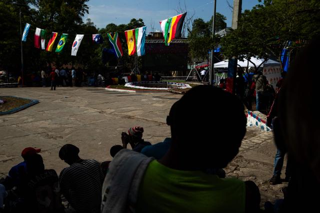 People watch a match during the 2026 World Cup football tournament in a square in Port-au-Prince, Haiti, June 12, 2026. The 2026 World Cup football tournament kicked off in Mexico City on June 11. (Photo by Clarens SIFFROY / AFP)