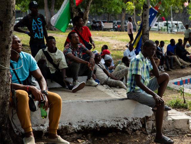 People watch a match during the 2026 World Cup football tournament in a square in Port-au-Prince, Haiti, June 12, 2026. The 2026 World Cup football tournament kicked off in Mexico City on June 11. (Photo by Clarens SIFFROY / AFP)