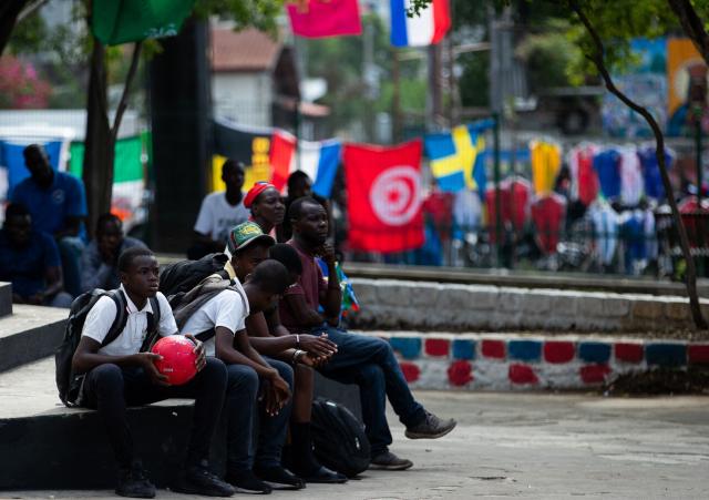People watch a match during the 2026 World Cup football tournament in a square in Port-au-Prince, Haiti, June 12, 2026. The 2026 World Cup football tournament kicked off in Mexico City on June 11. (Photo by Clarens SIFFROY / AFP)