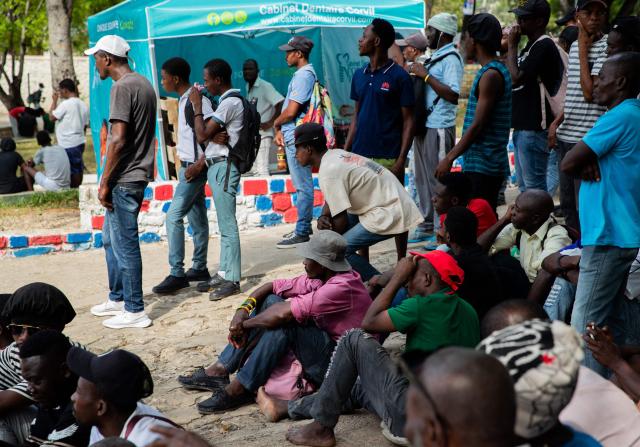 People watch a match during the 2026 World Cup football tournament in a square in Port-au-Prince, Haiti, June 12, 2026. The 2026 World Cup football tournament kicked off in Mexico City on June 11. (Photo by Clarens SIFFROY / AFP)