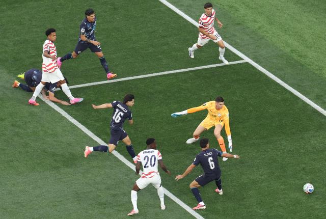 Paraguay's midfielder #16 Damian Bobadilla (C) scores an own goal during the 2026 World Cup Group D football match between USA and Paraguay at the Los Angeles Stadium in Inglewood on June 12, 2026. (Photo by Valerie MACON / AFP)