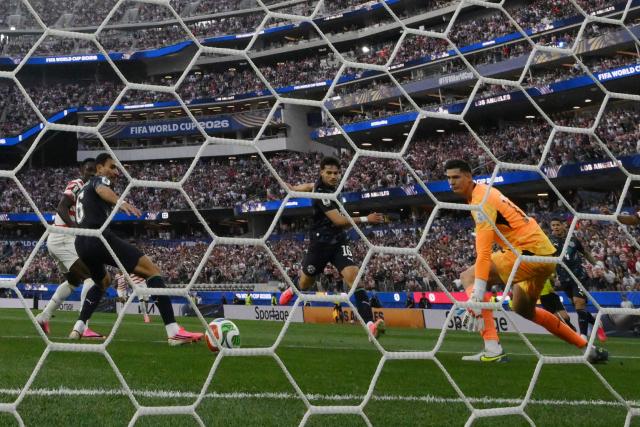 Paraguay's midfielder #16 Damian Bobadilla (C) scores an own goal the 2026 World Cup Group D football match between USA and Paraguay at the Los Angeles Stadium in Inglewood on June 12, 2026. (Photo by Patrick T. Fallon / AFP)