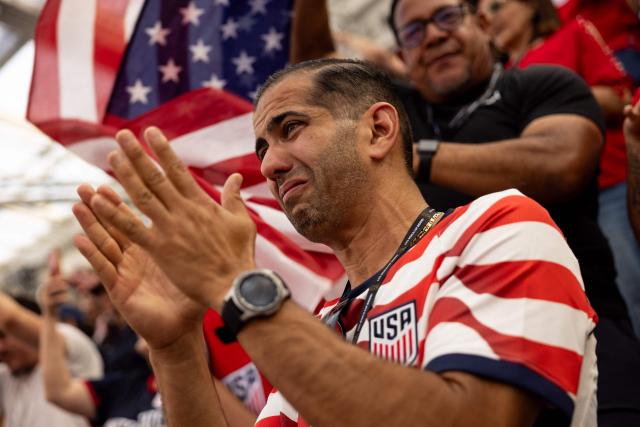A USA fan reacts during the US national anthem prior to the 2026 World Cup Group D football match between USA and Paraguay at the Los Angeles Stadium in Inglewood, California, on June 12, 2026. (Photo by ETIENNE LAURENT / AFP)