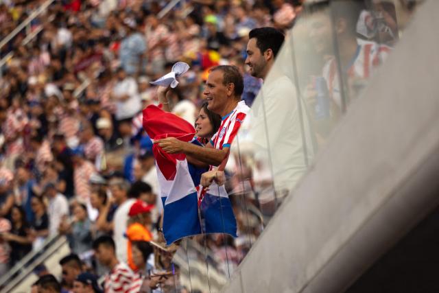 Paraguay fans cheer prior to the 2026 World Cup Group D football match between USA and Paraguay at the Los Angeles Stadium in Inglewood, California, on June 12, 2026. (Photo by ETIENNE LAURENT / AFP)
