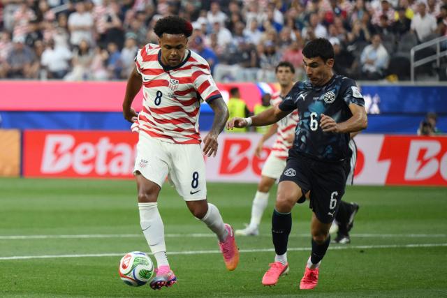US midfielder #08 Weston McKennie and Paraguay's defender #06 Junior Alonso fight for the ball during the 2026 World Cup Group D football match between USA and Paraguay at the Los Angeles Stadium in Inglewood on June 12, 2026. (Photo by Patrick T. Fallon / AFP)