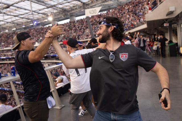 USA fans celebrate after the US scored a second goal during the 2026 World Cup Group D football match between USA and Paraguay at the Los Angeles Stadium in Inglewood, California, on June 12, 2026. (Photo by ETIENNE LAURENT / AFP)