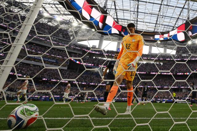 Paraguay's goalkeeper #12 Orlando Gill reacts after conceding US second goal scored by forward #20 Folarin Balogun (unseen) during the 2026 World Cup Group D football match between USA and Paraguay at the Los Angeles Stadium in Inglewood on June 12, 2026. (Photo by Patrick T. Fallon / AFP)