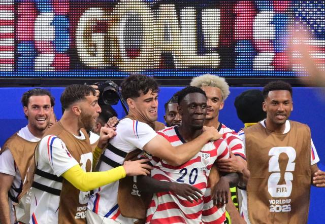 US forward #20 Folarin Balogun (C) celebrates scoring his team's third goal with teammates during the 2026 World Cup Group D football match between USA and Paraguay at the Los Angeles Stadium in Inglewood on June 12, 2026. (Photo by Frederic J. BROWN / AFP)