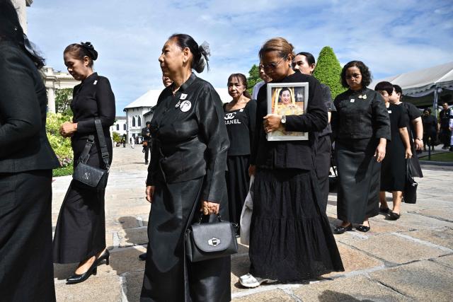 Members of the public arrive at the Palace to mourn the death of Thai Princess Bajrakitiyabha Mahidol in Bangkok on June 13, 2026. Thai Princess Bajrakitiyabha Mahidol, the king's eldest daughter, has died aged 47, the royal palace announced on June 12, more than three years after she was hospitalised following a sudden illness. (Photo by ANTHONY WALLACE / AFP)