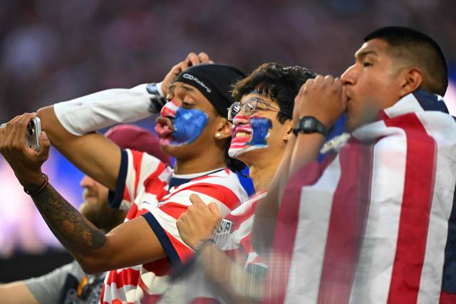 US fans cheer for their team during the 2026 World Cup Group D football match between USA and Paraguay at the Los Angeles Stadium in Inglewood on June 12, 2026. (Photo by Patrick T. Fallon / AFP)