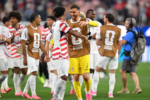 US goalkeeper #01 Matt Turner (R) and midfielder #08 Weston McKennie celebrate after winning the 2026 World Cup Group D football match between USA and Paraguay at the Los Angeles Stadium in Inglewood on June 12, 2026. (Photo by Patrick T. Fallon / AFP)