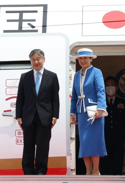 Japan's Emperor Naruhito (L) and Empress Masako look on before departing for their official visit to the Netherlands and Belgium at Haneda Airport in Tokyo on June 13, 2026. (Photo by JIJI PRESS / AFP) / Japan OUT