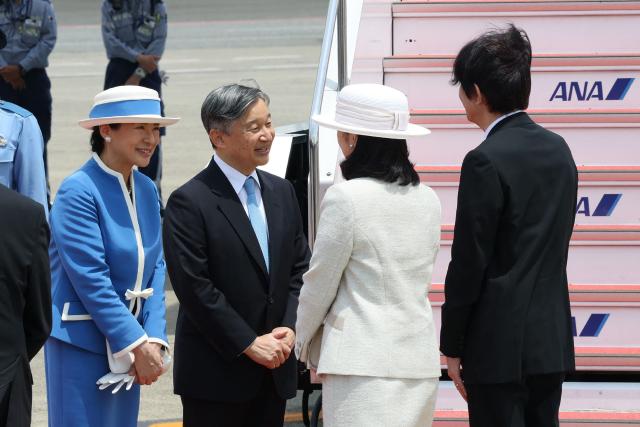 Japan's Emperor Naruhito (C) and Empress Masako (L) speak with Prince Akishino (R) and Princess Kiko before departing for their official visit to the Netherlands and Belgium at Haneda Airport in Tokyo on June 13, 2026. (Photo by JIJI PRESS / AFP) / Japan OUT
