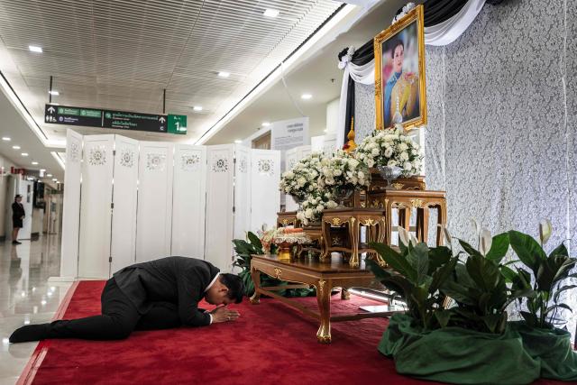 A mourner pays respects in front of a portrait of the late Thai Princess Bajrakitiyabha Mahidol at Chulalongkorn Hospital in Bangkok on June 13, 2026. Thai Princess Bajrakitiyabha Mahidol, the king's eldest daughter, has died aged 47, the royal palace announced on June 12, more than three years after she was hospitalised following a sudden illness. (Photo by chanakarn LAOSARAKHAM / AFP)