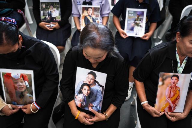 Mourners hold photos of late Thai Princess Bajrakitiyabha Mahidol at Chulalongkorn Hospital in Bangkok on June 13, 2026. Thai Princess Bajrakitiyabha Mahidol, the king's eldest daughter, has died aged 47, the royal palace announced on June 12, more than three years after she was hospitalised following a sudden illness. (Photo by chanakarn LAOSARAKHAM / AFP)