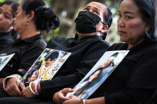 Mourners hold photos of late Thai Princess Bajrakitiyabha Mahidol at Chulalongkorn Hospital in Bangkok on June 13, 2026. Thai Princess Bajrakitiyabha Mahidol, the king's eldest daughter, has died aged 47, the royal palace announced on June 12, more than three years after she was hospitalised following a sudden illness. (Photo by chanakarn LAOSARAKHAM / AFP)
