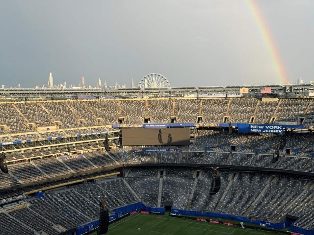A rainbow is seen in the distance from New York New Jersey Stadium in East Rutherford, New Jersey, on June 12, 2026. (Photo by Daniel SLIM / AFP)