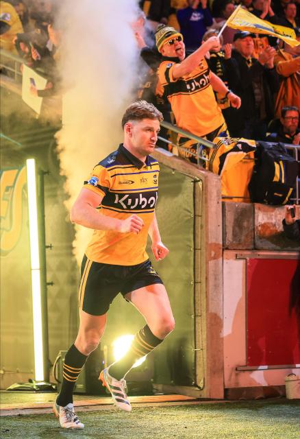 Hurricanes Jordie Barrett leads out his team during the Super Rugby Pacific semi-final match between the Wellington Hurricanes and Auckland Blues in Wellington on June 13, 2026. (Photo by Grant Down / AFP)