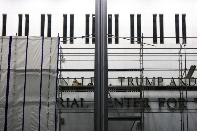 Scaffolding stands near the signage for the "Donald J. Trump and John F. Kennedy Memorial Center for the Performing Arts" in Washington, DC, on June 13, 2026. A US federal judge on June 12 rejected a bid by the board of the Kennedy Center and the Justice Department to halt the removal of President Donald Trump's name from the performing arts venue. (Photo by Alex WROBLEWSKI / AFP)