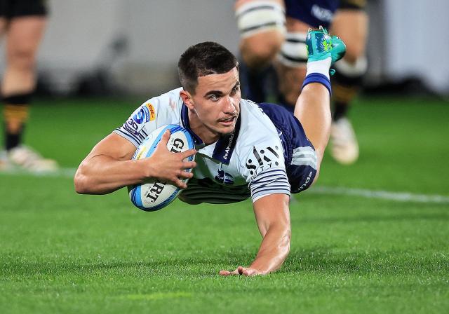 Blues Payton Spencer dives in to score a try during the Super Rugby Pacific semi-final match between the Wellington Hurricanes and Auckland Blues in Wellington on June 13, 2026. (Photo by Grant Down / AFP)