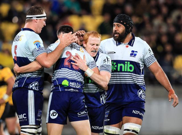 Blues players celebrate a try by Payton Spencer during the Super Rugby Pacific semi-final match between the Wellington Hurricanes and Auckland Blues in Wellington on June 13, 2026. (Photo by Grant Down / AFP)