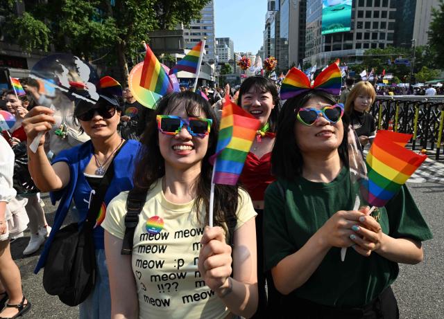Participants take part in a parade during a Pride event in support of LGBTQ rights as part of the Seoul Queer Culture Festival in Seoul on June 13, 2026. (Photo by Jung Yeon-je / AFP)