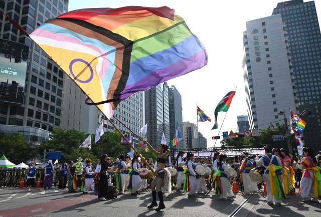 Participants take part in a parade during a Pride event in support of LGBTQ rights as part of the Seoul Queer Culture Festival in Seoul on June 13, 2026. (Photo by Jung Yeon-je / AFP)