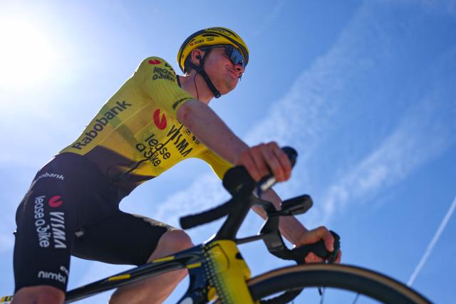 Team Visma | Lease a Bike's British rider Ben Tulett awaits the start of the 7th stage of the Tour Auvergne-Rhone-Alpes cycling race (formerly known as the Criterium du Dauphine), 133,6km between La Bridoire and Grand Colombier in the French Alps on June 13, 2026. (Photo by Anne-Christine POUJOULAT / AFP)