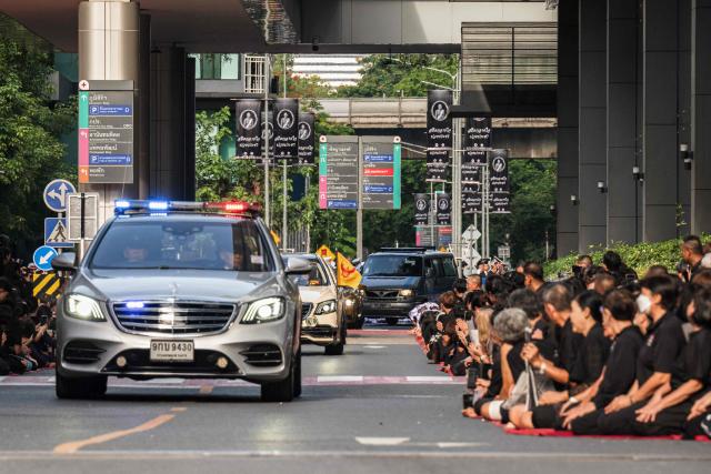 Mourners line the road to pay respects to Thai Princess Bajrakitiyabha Mahidol as her body is transported to the Grand Palace, where funeral rites will begin for the late princess, in Bangkok on June 13, 2026. Hundreds of black-clad Thai mourners gathered at the royal palace in Bangkok on June 13, awaiting the arrival of the body of the king's eldest daughter a day after her death was announced. (Photo by chanakarn LAOSARAKHAM / AFP)