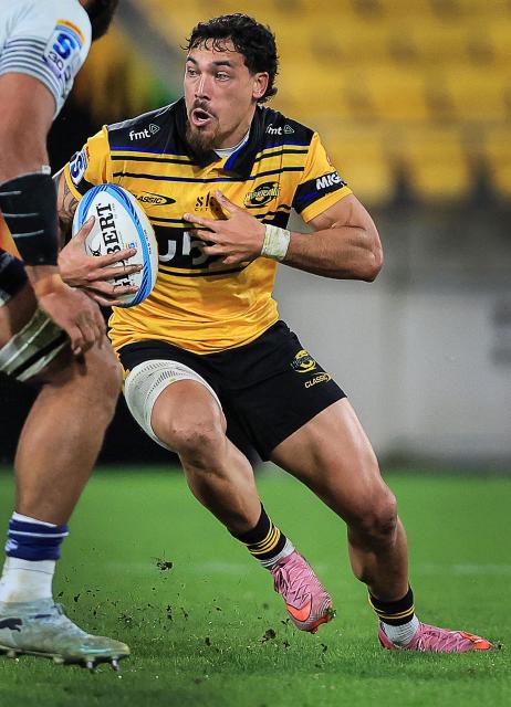 Hurricanes Billy Proctor runs the ball during the Super Rugby Pacific semi-final match between the Wellington Hurricanes and Auckland Blues in Wellington on June 13, 2026. (Photo by Grant Down / AFP)