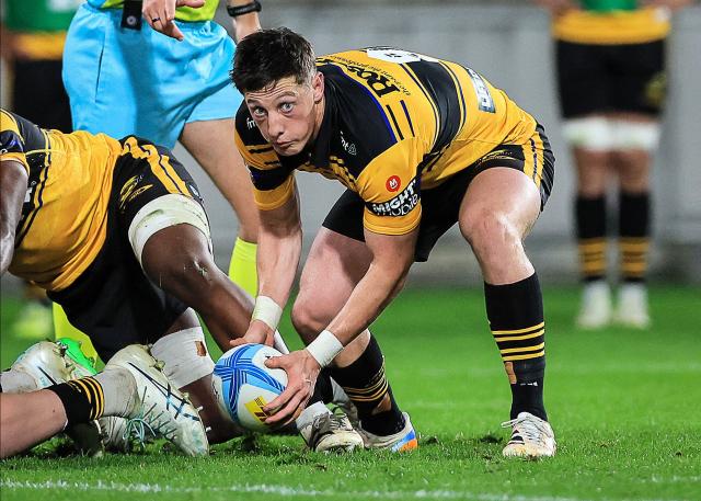 Hurricanes Cam Roigard looks to make a pass during the Super Rugby Pacific semi-final match between the Wellington Hurricanes and Auckland Blues in Wellington on June 13, 2026. (Photo by Grant Down / AFP)