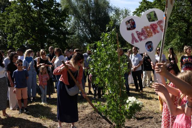 Mourners take part in a tribute ceremony for the victims of a femicide and two infanticides in Villers-en-Arthies, in the Ile-de-France region, on June 13, 2026. A municipal police officer on May 10, 2026 was suspected of having shot and killed his ex-partner and their two children aged 9 and 13 at his home in Villers-en-Arthies, before turning his service weapon on himself. (Photo by Behrouz MEHRI / AFP)