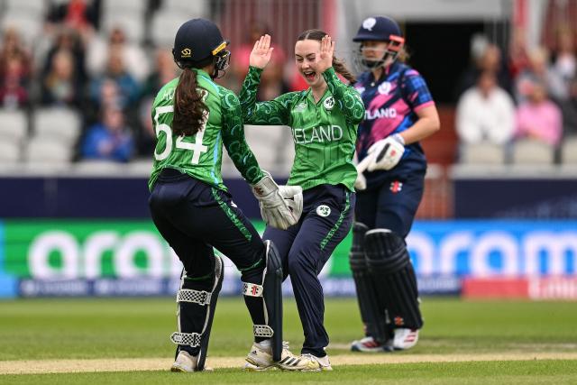 Ireland's Amy Hunter (L) and Ireland's Aimee Maguire (C) celebrate after taking the wricket of Scotland's Darcey Carter (not pictured) on the second day of the ICC Women's T20 cricket World Cup 2026 Group 2 stage cricket match between Scotland and Ireland at the Old Trafford Cricket Ground in Manchester, northern England, on June 13, 2026. (Photo by Oli SCARFF / AFP)