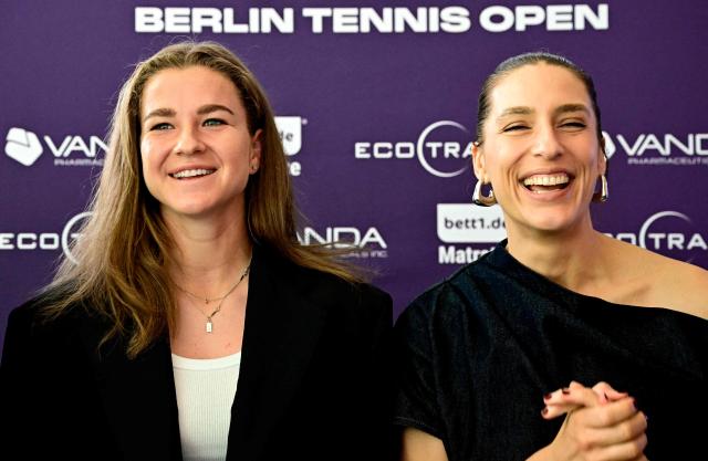 Czech Republic's Karolina Muchova (L) and German former tennis player Andrea Petkovic (R) react during a press conference in Berlin on June 13, 2026, ahead of the WTA500 Berlin Tennis Open tournament starting on June 15. (Photo by Tobias SCHWARZ / AFP)