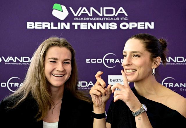 Czech Republic's Karolina Muchova (L) and German former tennis player Andrea Petkovic (R) react during a press conference in Berlin on June 13, 2026, ahead of the WTA500 Berlin Tennis Open tournament starting on June 15. (Photo by Tobias SCHWARZ / AFP)