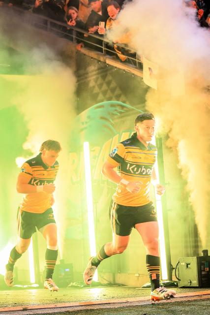 Hurricanes Cam Roigard (R) and Ruben Love take to the field during the Super Rugby Pacific semi-final match between the Wellington Hurricanes and Auckland Blues in Wellington on June 13, 2026. (Photo by Grant Down / AFP)