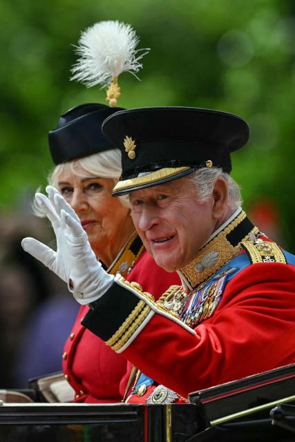Britain's King Charles III and Britain's Queen Camilla arrive to attend the King's Birthday Parade "Trooping the Colour" in London on June 13, 2026. (Photo by JUSTIN TALLIS / AFP)
