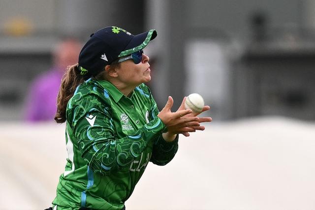 Ireland's Cara Murray catches the ball to take the wicket of Scotland's captain Kathryn Bryce on the second day of the ICC Women's T20 cricket World Cup 2026 Group 2 stage cricket match between Scotland and Ireland at the Old Trafford Cricket Ground in Manchester, northern England, on June 13, 2026. (Photo by Oli SCARFF / AFP)