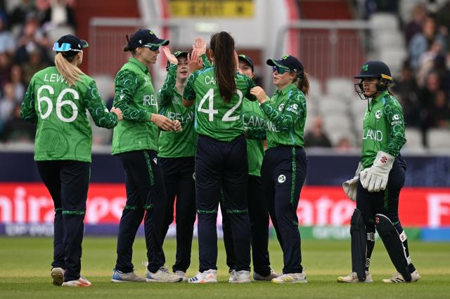 Ireland players celebrate taking the wicket of Scotland's captain Kathryn Bryce on the second day of the ICC Women's T20 cricket World Cup 2026 Group 2 stage cricket match between Scotland and Ireland at the Old Trafford Cricket Ground in Manchester, northern England, on June 13, 2026. (Photo by Oli SCARFF / AFP)