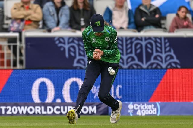 Ireland's Alice Tector drops a ball for a potential out from Scotland's Ailsa Lister on the second day of the ICC Women's T20 cricket World Cup 2026 Group 2 stage cricket match between Scotland and Ireland at the Old Trafford Cricket Ground in Manchester, northern England, on June 13, 2026. (Photo by Oli SCARFF / AFP)