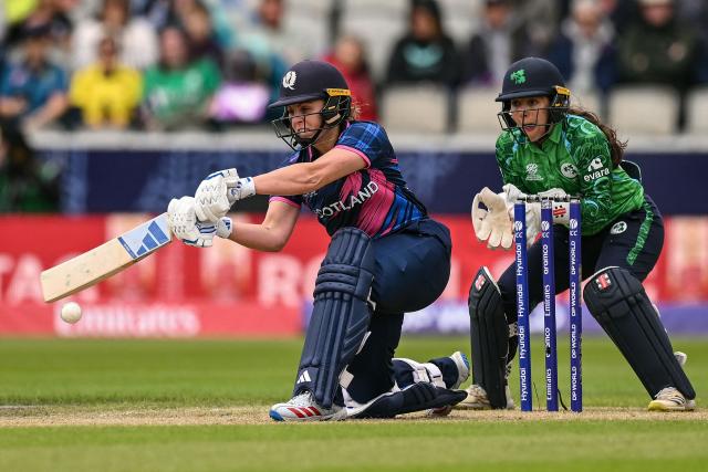 Scotland's Ailsa Lister (L) plays a shot on the second day of the ICC Women's T20 cricket World Cup 2026 Group 2 stage cricket match between Scotland and Ireland at the Old Trafford Cricket Ground in Manchester, northern England, on June 13, 2026. (Photo by Oli SCARFF / AFP)