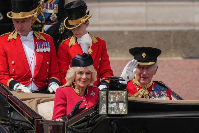 Britain's Queen Camilla and Britain's King Charles III arrive to attend the King's Birthday Parade "Trooping the Colour" in London on June 13, 2026. (Photo by CARLOS JASSO / AFP)
