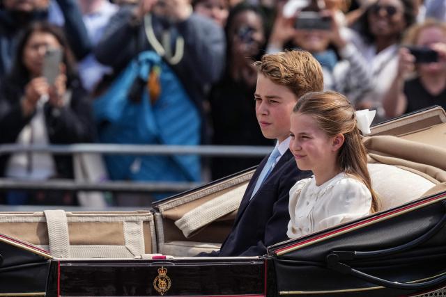 Britain's Prince George of Wales and Britain's Princess Charlotte of Wales arrive to attend the King's Birthday Parade "Trooping the Colour" in London on June 13, 2026. (Photo by CARLOS JASSO / AFP)